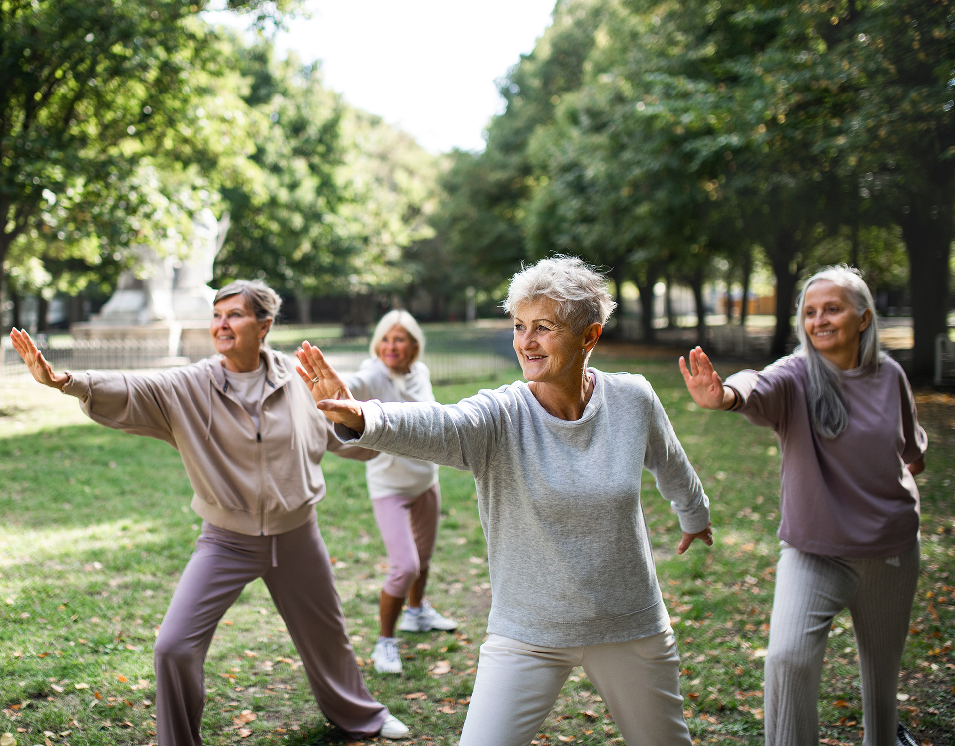 A group of woman practicing Tai Chi.