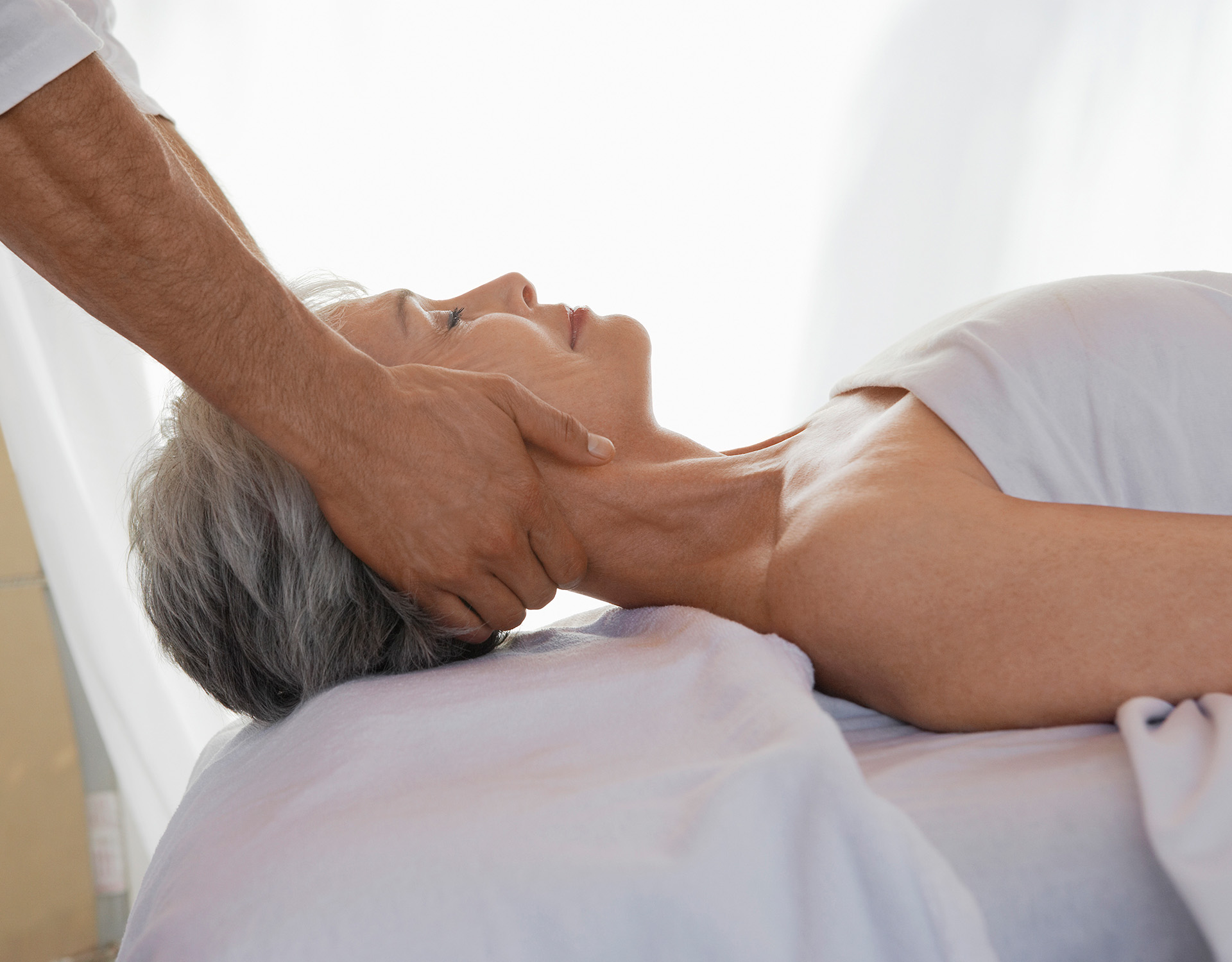 Woman receiving a neck massage.